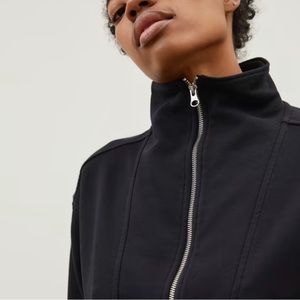 Everlane: Track Half Zip.